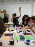 students doing printmaking with lots of color ink and action